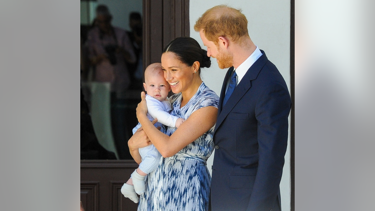 Meghan Markle holding baby Archie with Prince Harry