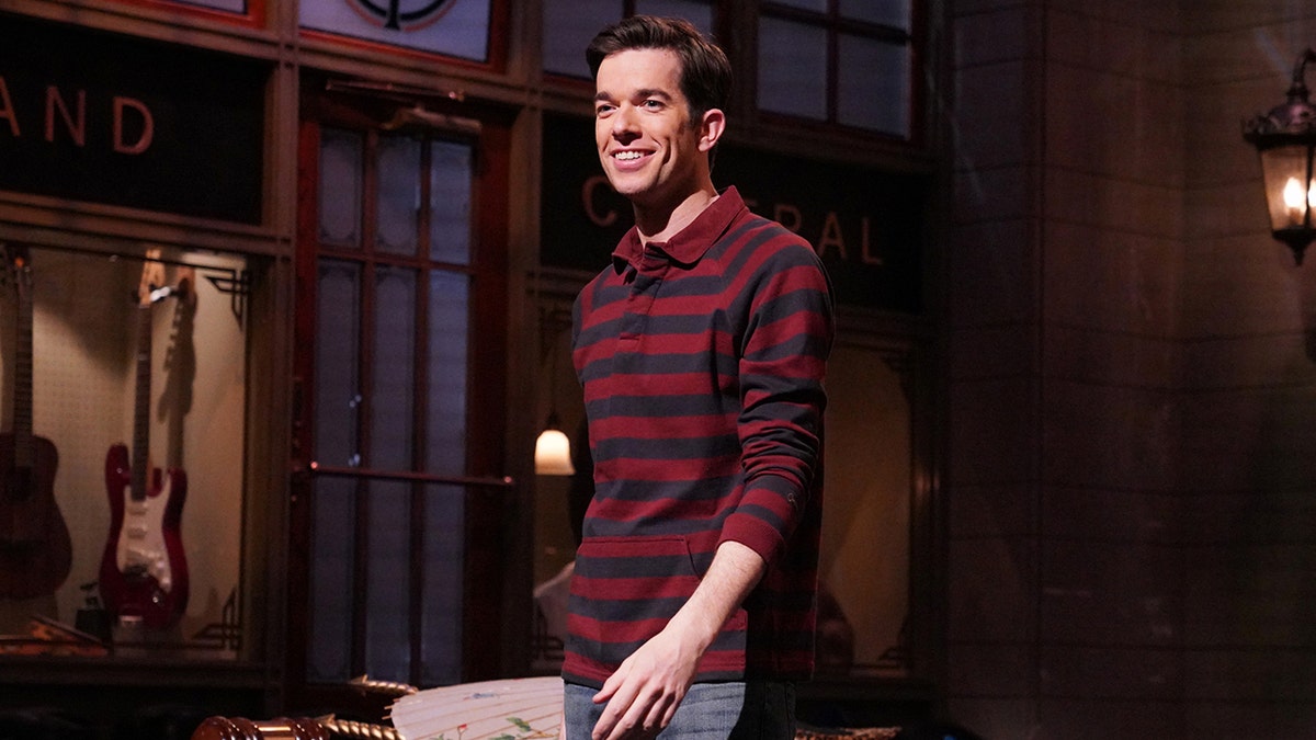 John Mulaney wears red plaid shirt while hosting Saturday Night Live