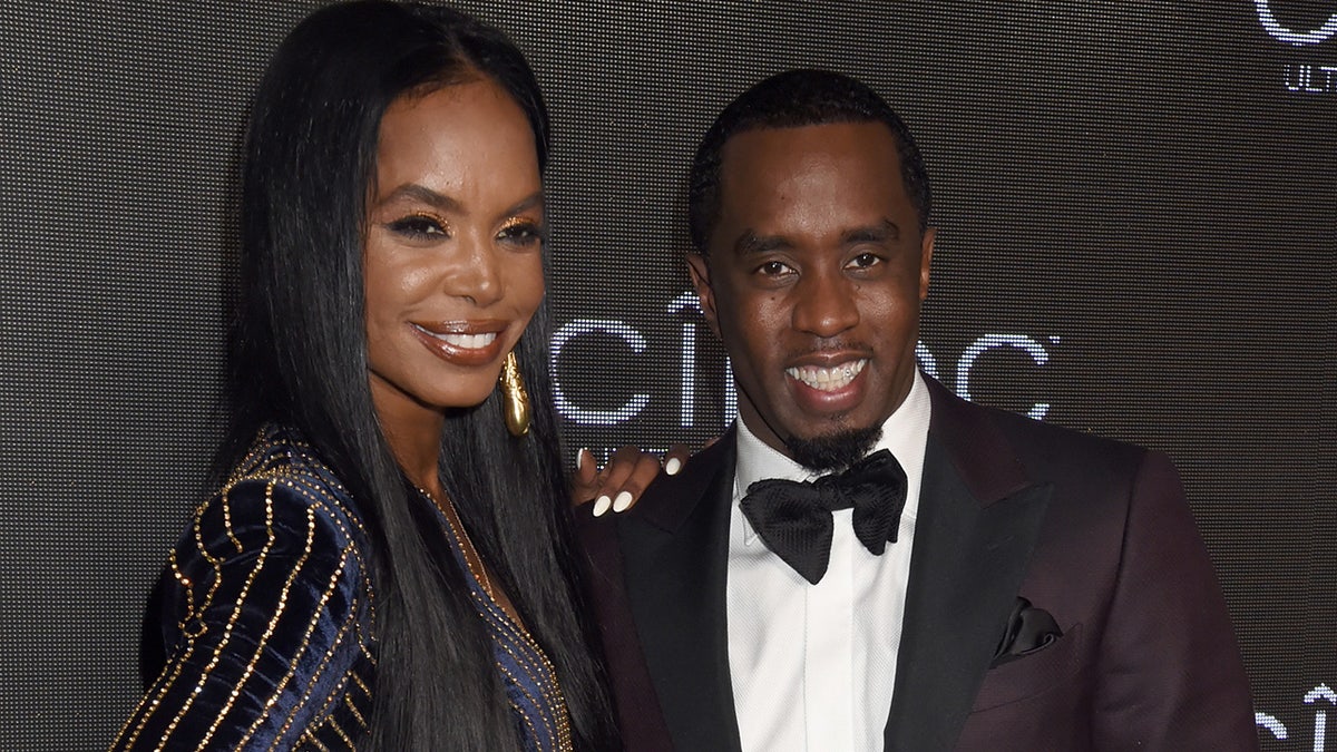 Kim Porter wears sparkling navy blue dress to Ciroc event with Puff Daddy