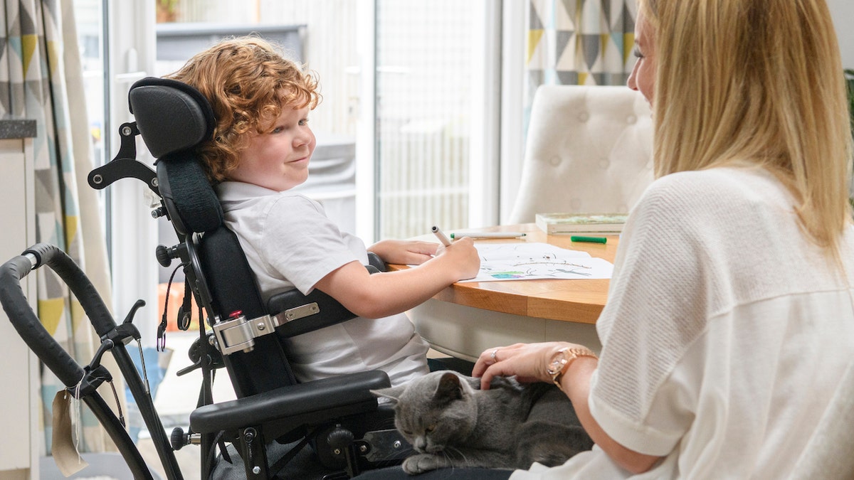 Muscular dystrophy boy with mom