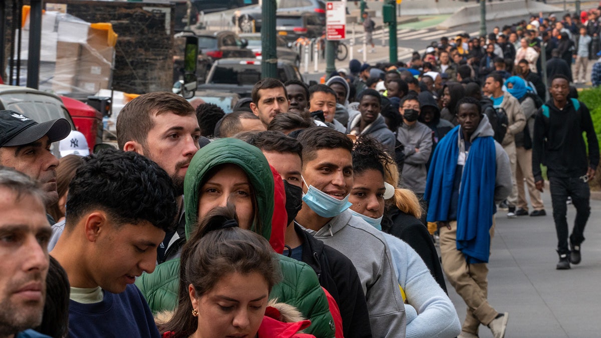 Asylum-seekers outside Javits building