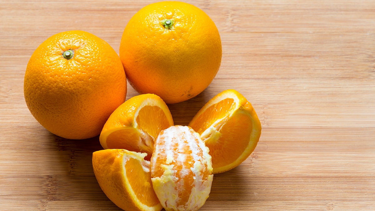 Oranges on a cutting board