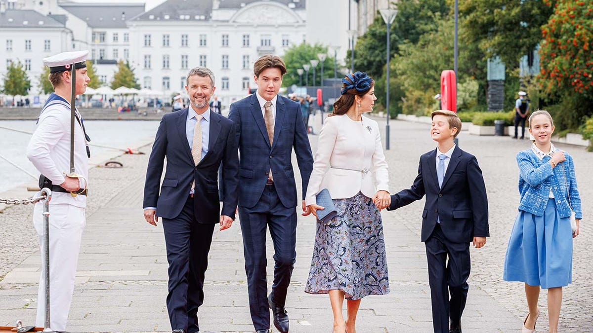 Prince Christian walking with his family