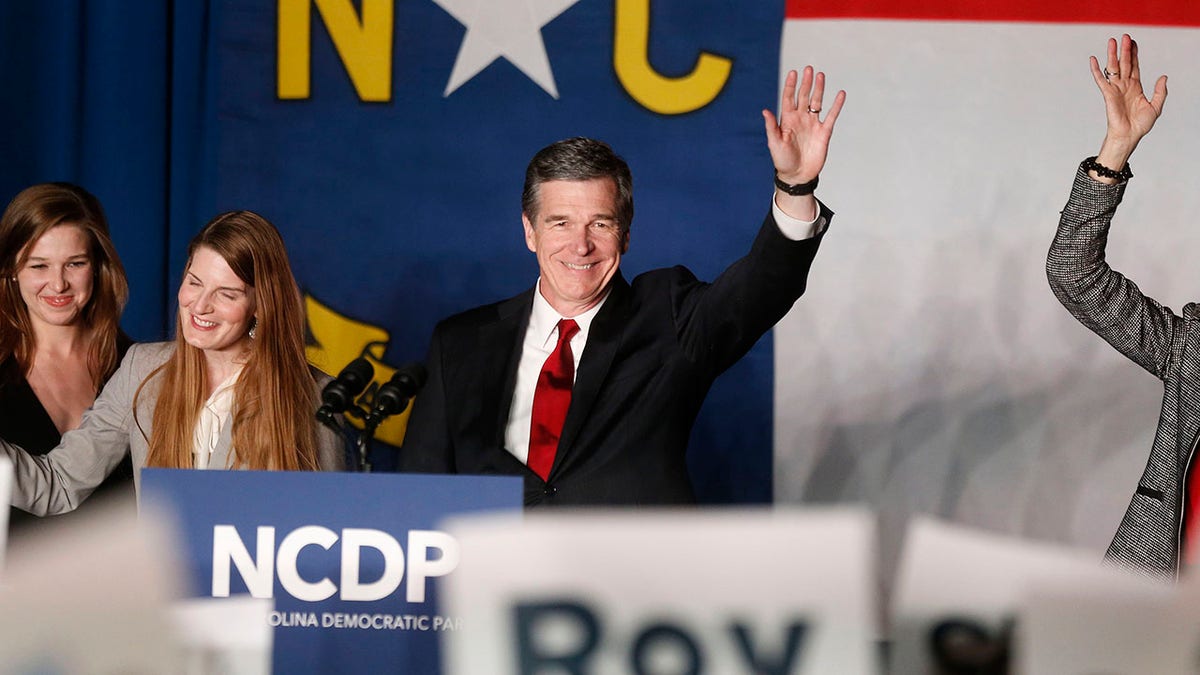 Roy Cooper waves