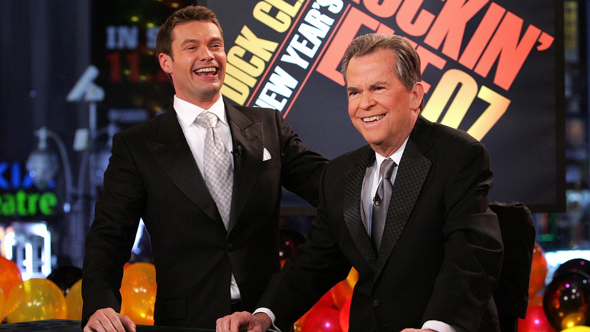 Ryan Seacrest laughs with Dick Clark on annual new Year's Eve broadcast