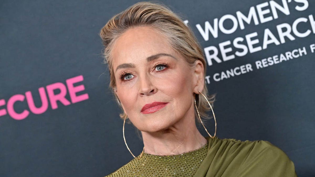 sharon stone looking serious on red carpet