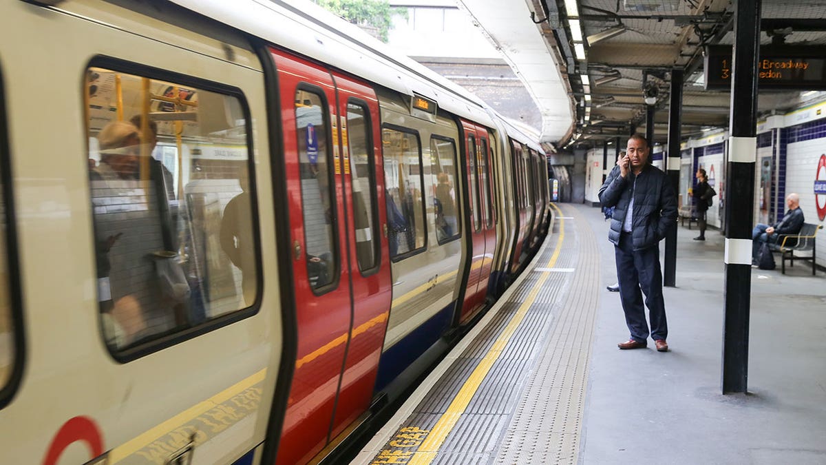 A subway train at Sloane Square station in London, England