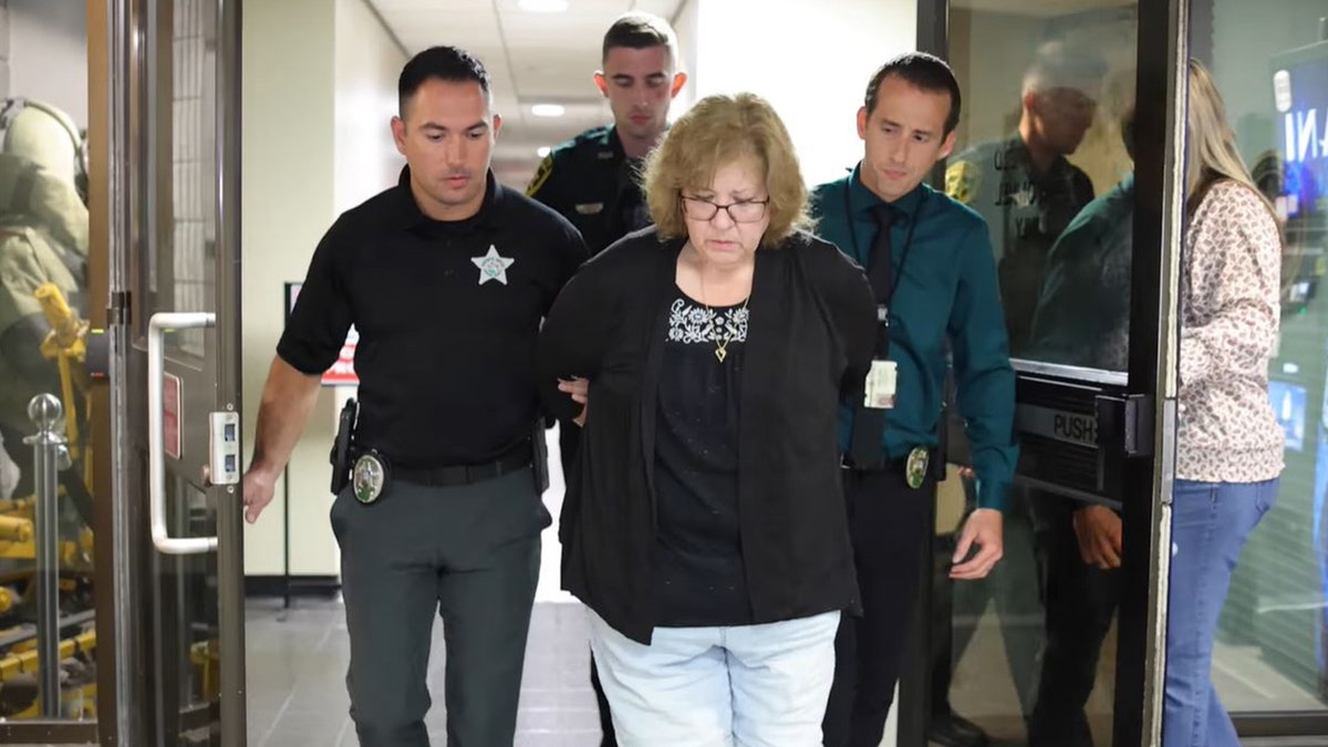 susan lorincz walking handcuffed