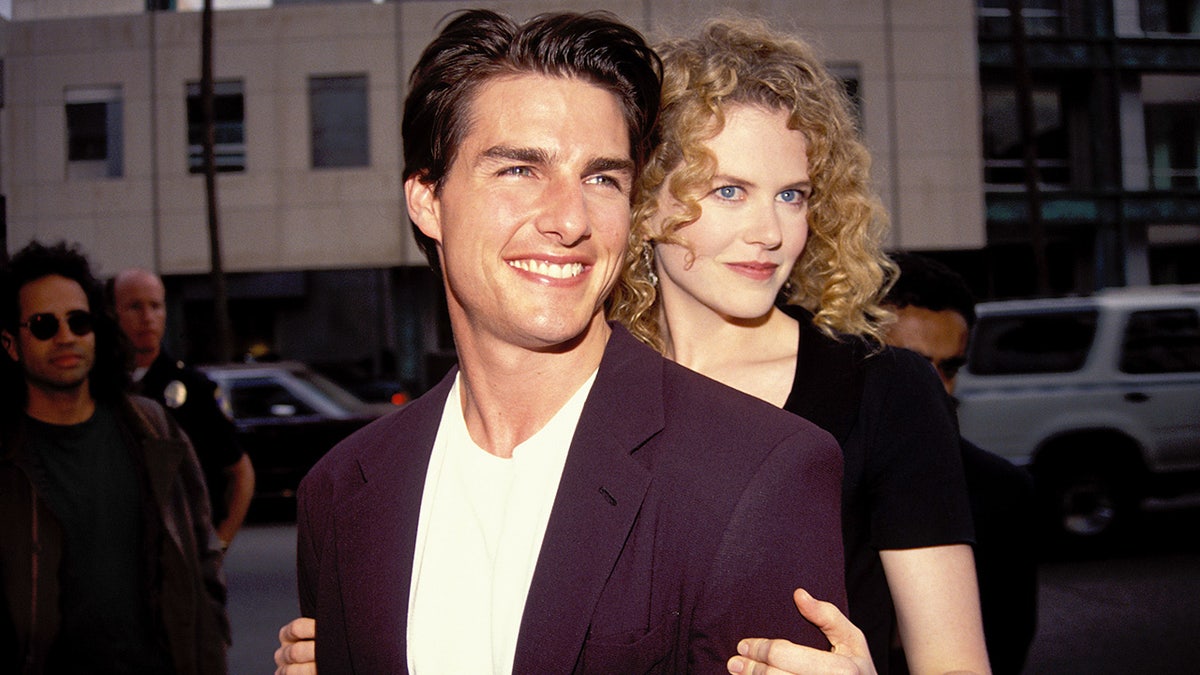 Nicole Kidman hugs husband Tom Cruise from behind