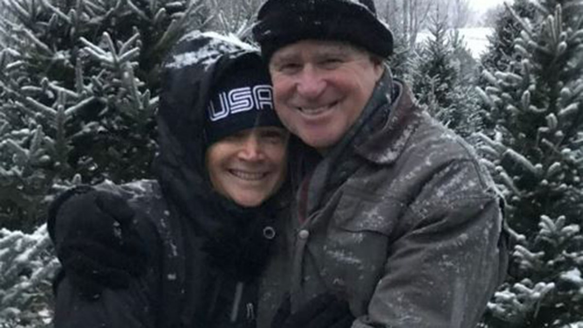 Treat Williams wears hat and winter coat with wife Pam Van Sant