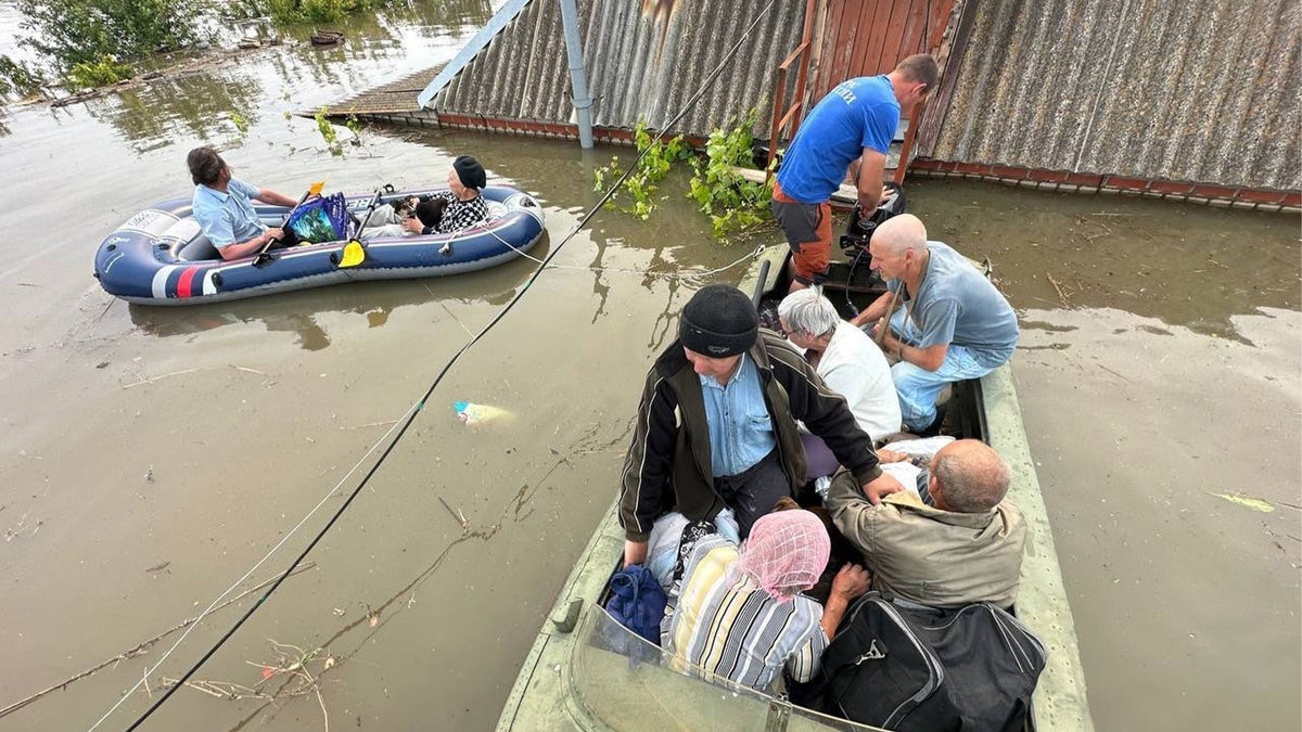 a photo of Kherson residents in boats