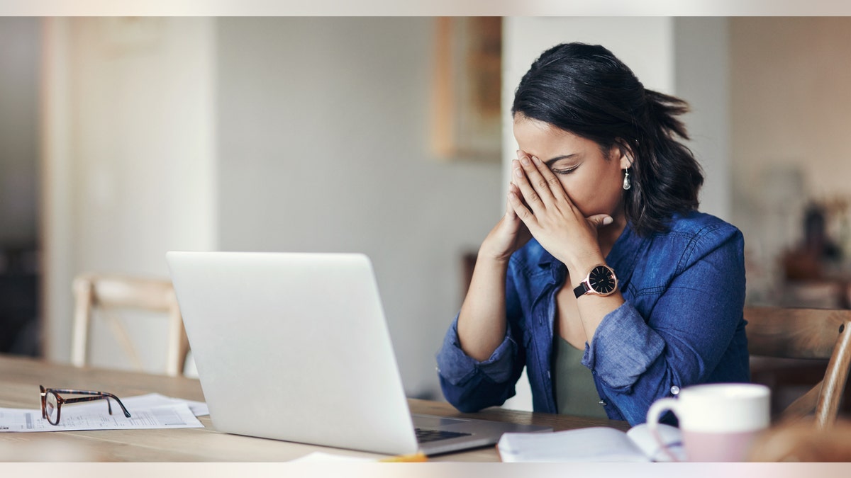 Upset woman on computer