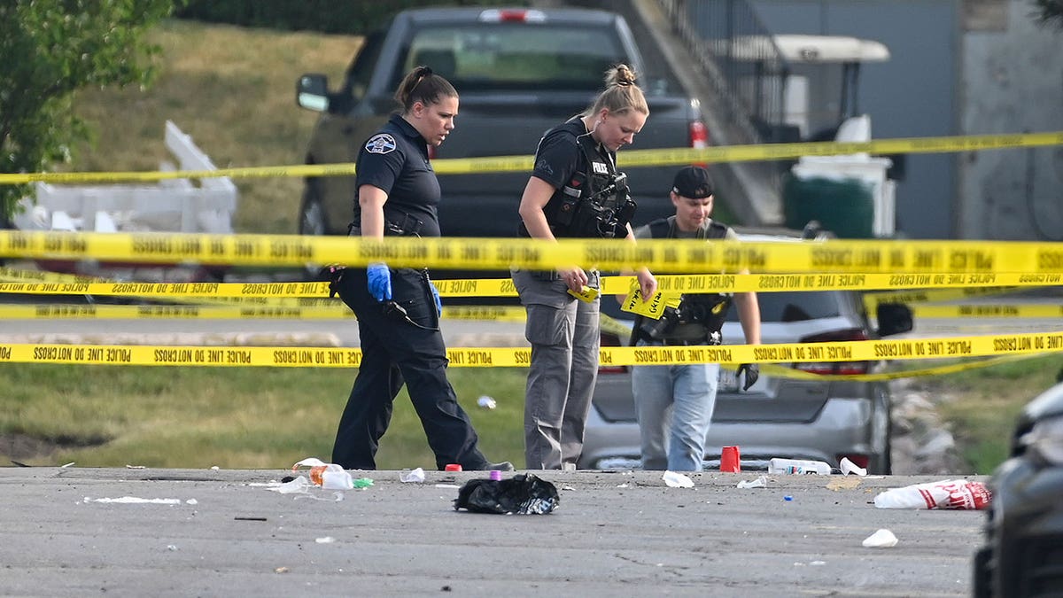 crime scene tape and police at the willowbrook shooting scene