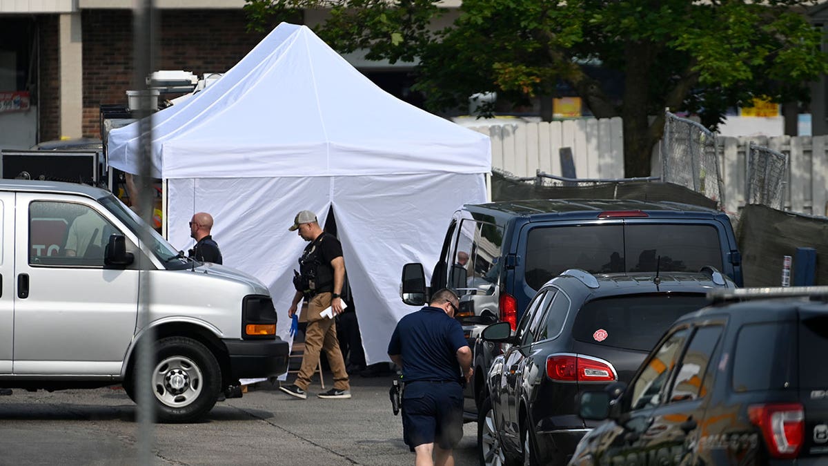 investigators set up tent by willowbrook shooting scene