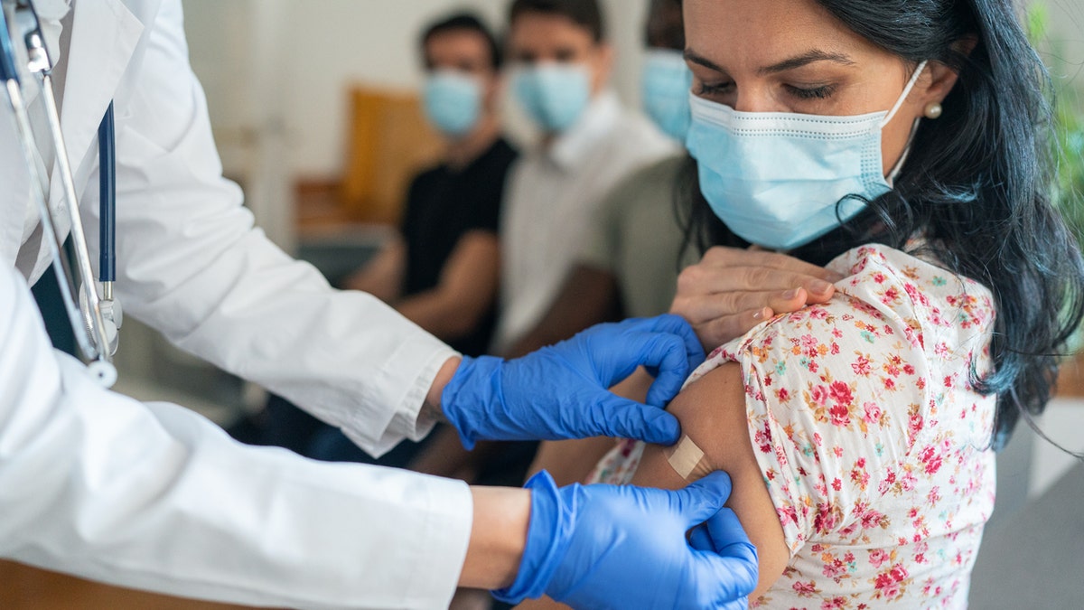 Woman getting vaccine