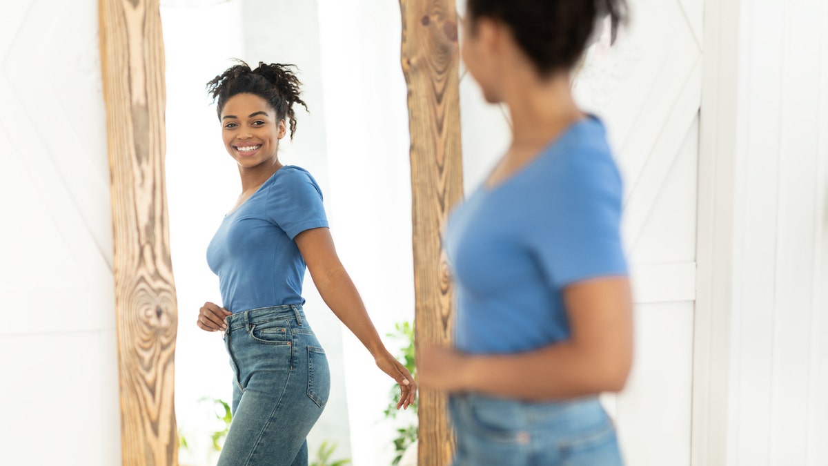 Woman smiling in mirror