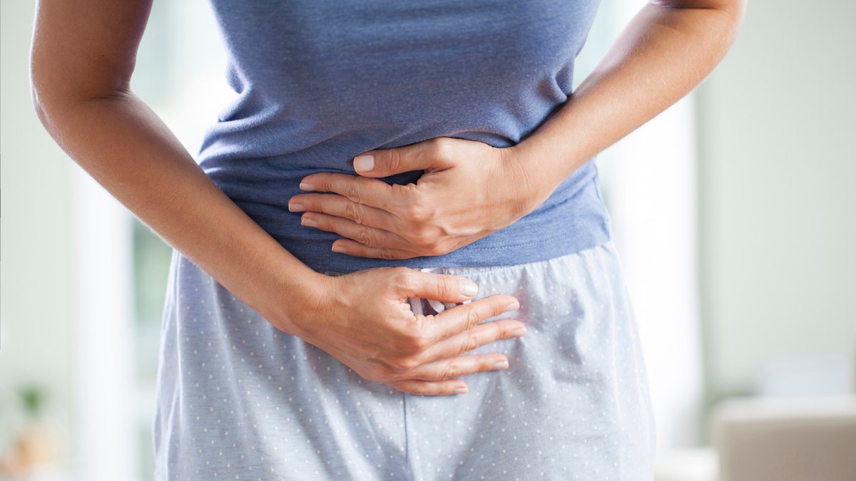 Woman with stomach pain