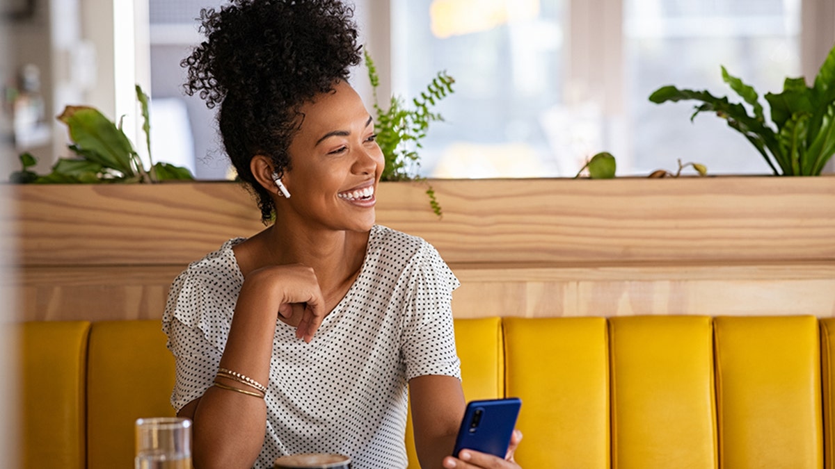 Woman wearing earbuds