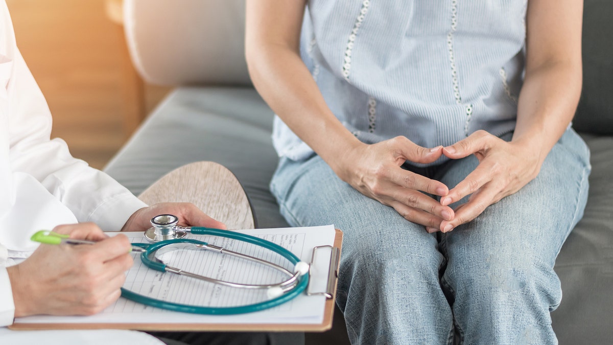 Woman with doctor