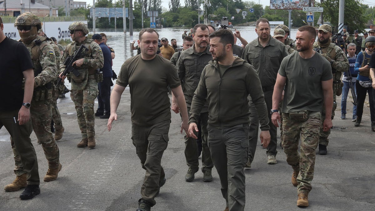 a photo of Volodomyr Zelenskyy walking through Kherson, Ukraine