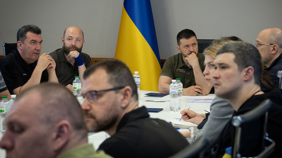 Zelenskyy at conference table with other officials