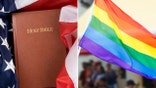 Holy Bible wrapped in an American flag and pride flag held up at event.