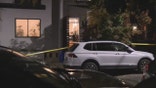 Airbnb rental, yellow police tape and white car parked outside