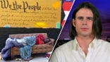 Left, a man sleeps on a couch in front of a wall with "We the People" written on it. Right Darren Mark Stallcup