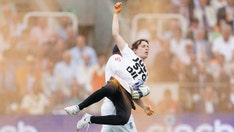 Cricket player carries Just Stop Oil protester off pitch before match