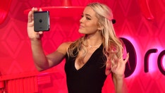 Olivia Dunne draws crowd while watching LSU at College World Series