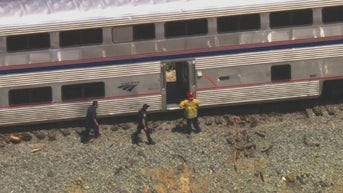 California Amtrak train derails after colliding with vehicle