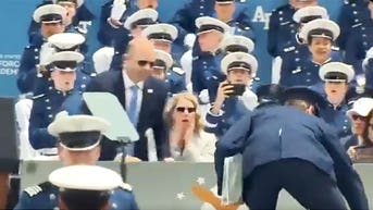 Air Force cadets react after Biden falls right in front of them during commencement