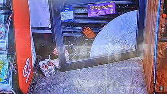 Shop clerk traps would-be thief under store shutter until police arrive