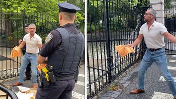 Conservative artist throws pizza at New York City Hall in response to coal-fired oven crackdown