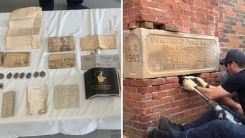 Firefighters pull 118-year-old time capsule from fire station wall