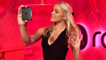 Olivia Dunne draws crowd while watching LSU at College World Series