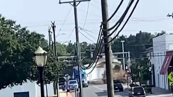 North Carolina freight train collides with semi-truck in dramatic video