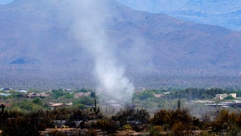 Over a thousand Arizona evacuees return home as firefighters contain brush fire