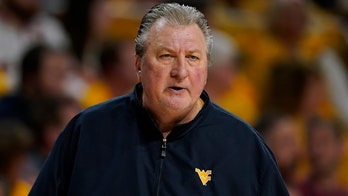 West Virginia basketball promotes Josh Eilert to interim coach after Bob Huggins' abrupt exit