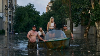 Ukrainians escape flooding after dam collapses, as many as 20,000 need to relocate