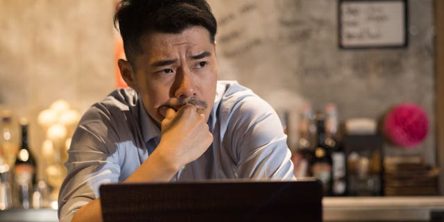 Man sitting on his laptop.