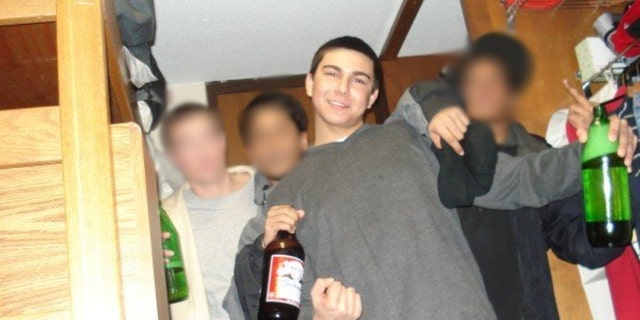 Matthew Nilo posing with friends and alcohol in 2007