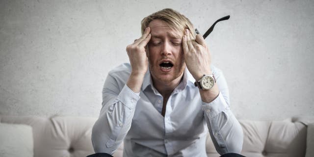 Image of man screaming in stress