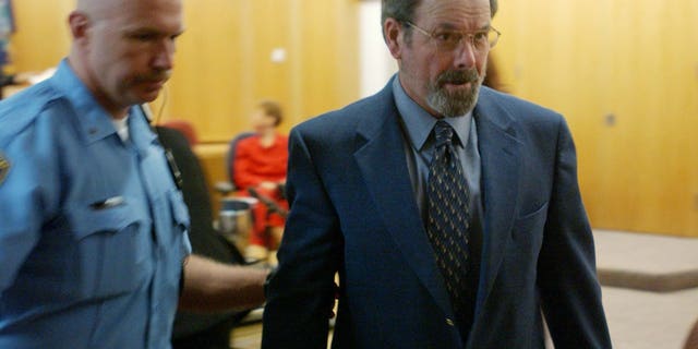 BTK murders suspect Dennis Rader is led out of his arraignment in Wichita Kansas.