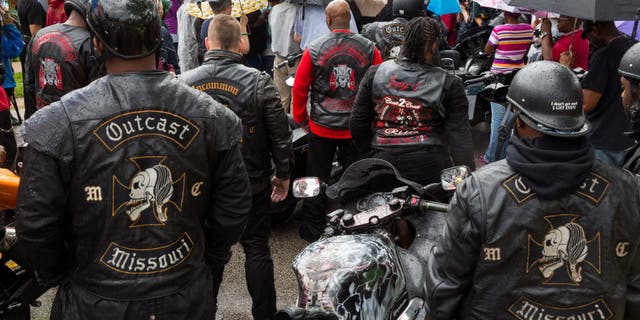 Outcast Motorcycle Club members wearing their biker vests
