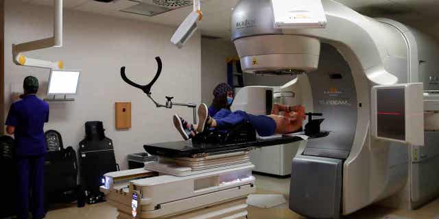 A patient is seen during a stereotactic radiotherapy treatment