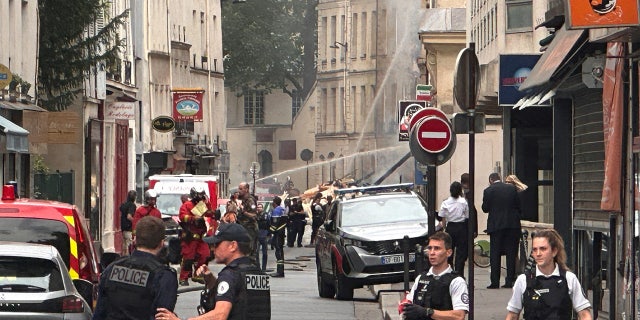 French police and firefighters respond to Paris explosion