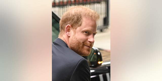 A close-up of Prince Harry coming out of his car