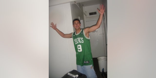 Matthew Nilo wearing a Celtics jersey