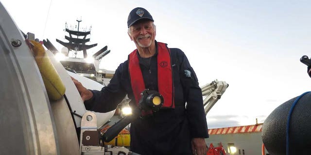 Missing mariner Paul-Henry Nargeolet poses next to OceanGate's Titan submersible in 2022